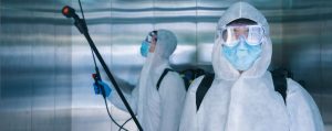 Covid disinfecting team in Chicago elevator