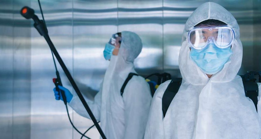 Covid disinfecting team in Chicago elevator