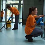 Professional commercial cleaning crew cleaning an office building.