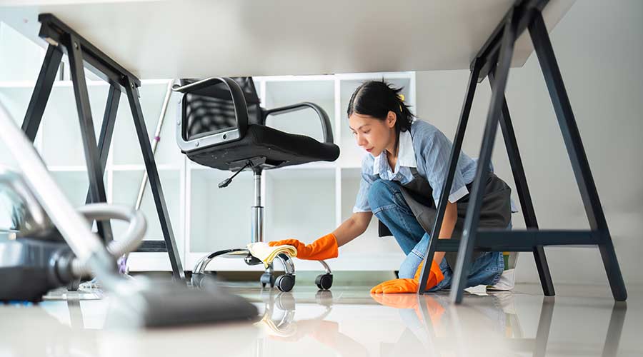 Lady cleaning in office work area
